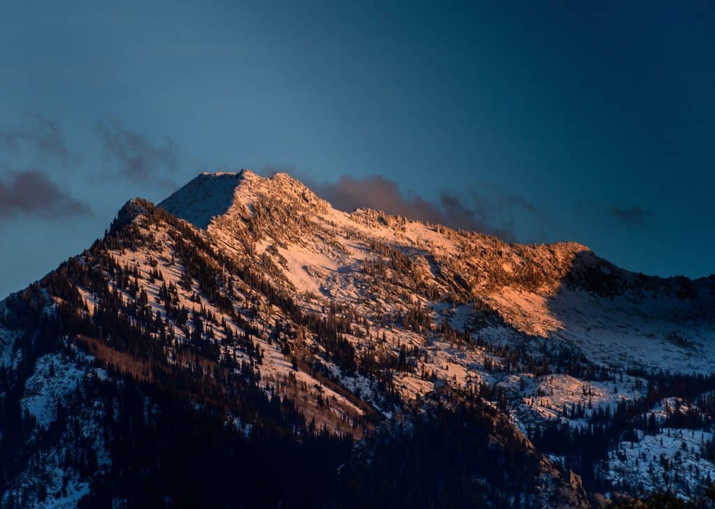 pexels photo 2395812 2395812 Experience the serene beauty of a snow-capped mountain peak at sunrise in Salt Lake City.