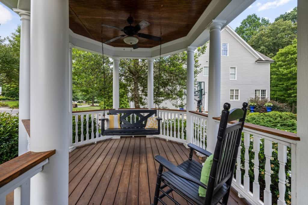 pexels photo 12700533 12700533 Inviting porch with rocking chair and swing, perfect for relaxation.